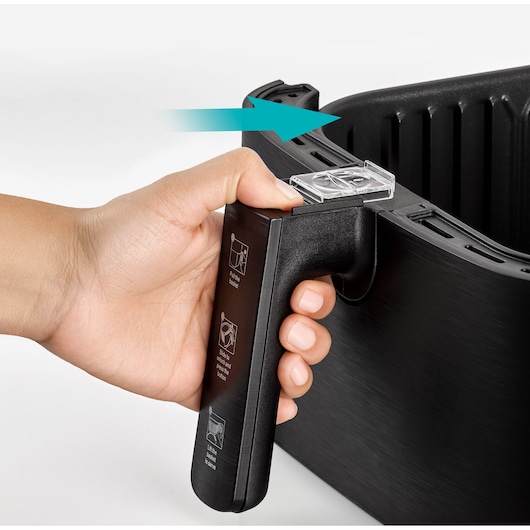 BLACKDECKER AF700 air fryer basket handle held by hand, closeup side view on white background.