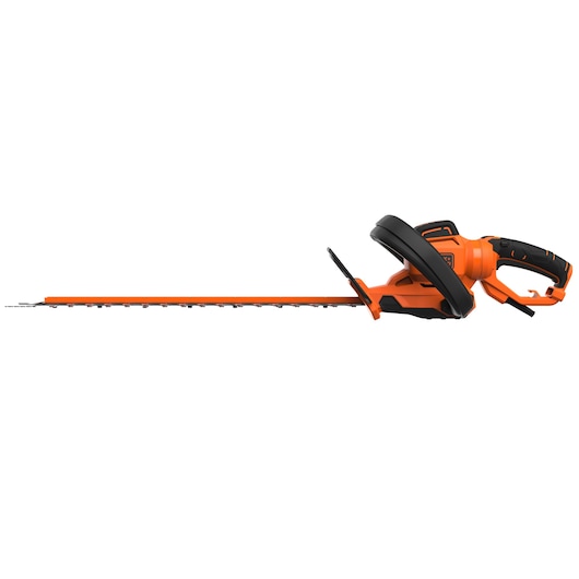 Side view of an orange and black electric hedge trimmer with an ergonomic handle and a long blade, suitable for garden maintenance.