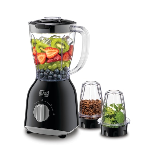 A BLACK+DECKER blender with a transparent jar filled with assorted fresh fruits, ice cubes, blueberries, grapes, kiwi slices, and strawberries. Next to the blender are two small containers, one containing coffee beans and the other containing fresh herbs. The blender and containers have black bases and are arranged on a white background.