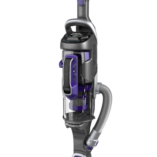 Close-up image of a BLACK+DECKER upright vacuum cleaner with a detachable handheld unit and visible hose, featuring grey and purple accents.
