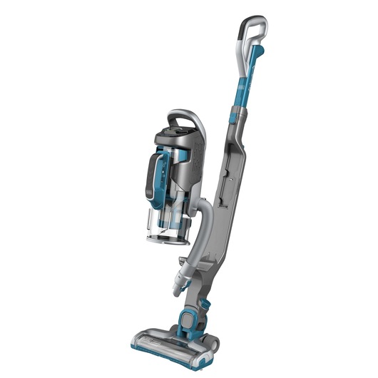 A BLACK+DECKER upright cordless vacuum cleaner with a detachable canister, predominantly grey and blue in color, standing against a white background.