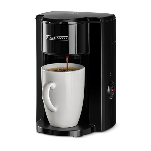 A black BLACK+DECKER single-serve coffee maker brewing coffee into a white ceramic mug.
