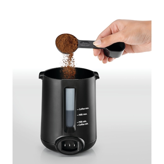 Automatic Turkish Coffee Maker Black and Decker Dual Size measuring spoon adding coffee powder in the jug filled with water