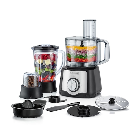 BLACK+DECKER FX650 multifunction food processor set with various attachments including a blender jar filled with fruit, a grinder with coffee beans, a citrus juicer, a spatula, slicing and grating discs, all displayed on a white background.
