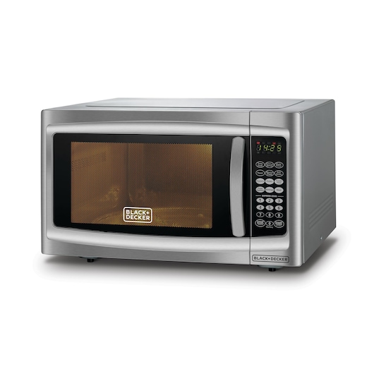 A silver BLACK+DECKER microwave oven with a digital display and a keypad on the right side. The door has a handle and a mesh window with the BLACK+DECKER logo visible.