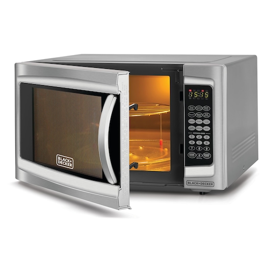 A BLACK+DECKER microwave oven with a silver finish, shown with the door open to display the illuminated interior, glass turntable, and digital control panel.