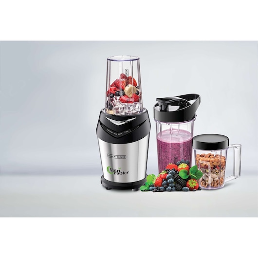 BLACKDECKER NE600 blender with smoothie cup, nut container and fresh berries on white background front angle