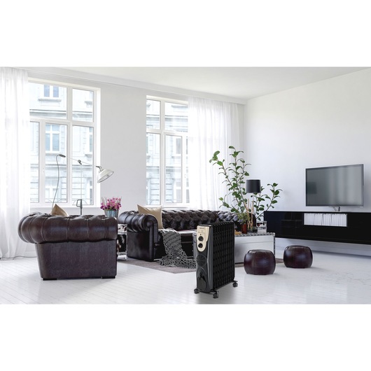 BLACKDECKER OR011FD radiator heater in modern living room with leather sofas and large windows.