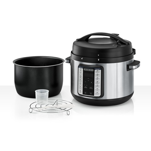 A BLACK+DECKER electric pressure cooker with a digital control panel, detachable inner pot, measuring cup, metal rack, and plastic spoon displayed together on a white background.