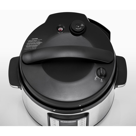 Photo of BLACKDECKER PCP1010 stainless steel electric pressure cooker, top view showing black lid with safety valve.