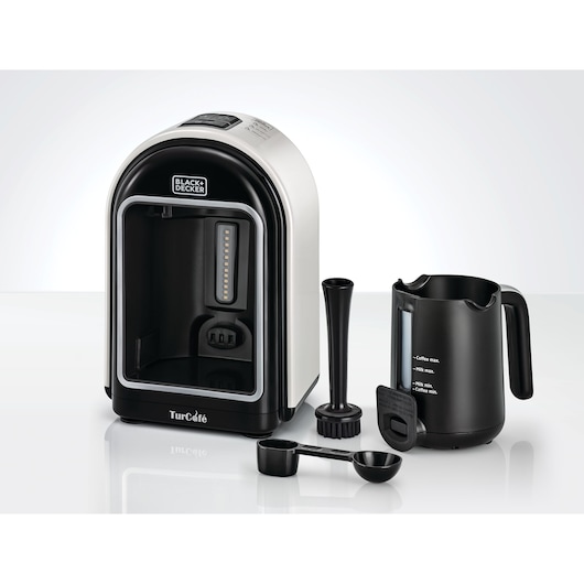 BLACK+DECKER TCM730 Turkish coffee maker with included accessories such as serving pot, measuring spoon, mixing and cleaning tools, displayed on a white surface.
