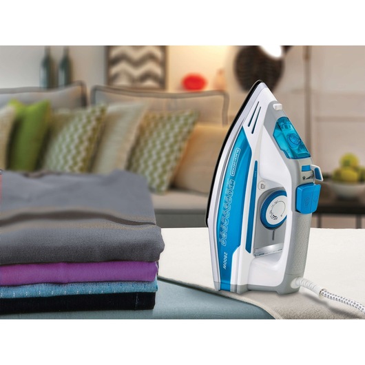 BLACKDECKER X2800 steam iron with blue and white design, shown next to folded clothes in a home setting.