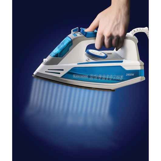 Photo of BLACKDECKER X2800 steam iron held by hand, blue and white design, product left side view.